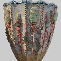 Decorative mosaic sculpture of a plant with intricate details on a planter.
