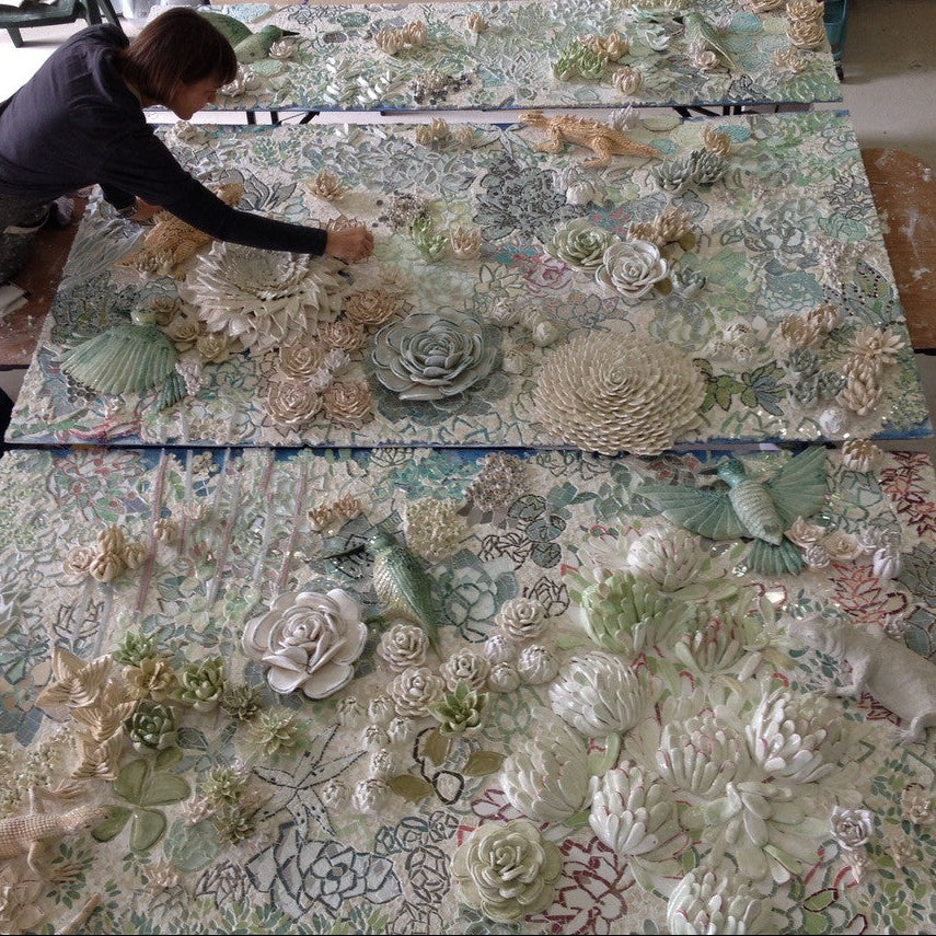 Jane du Rand working on a large floral ceramic mosaic mural