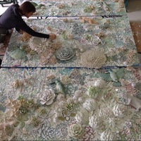 Jane du Rand working on a large floral ceramic mosaic mural