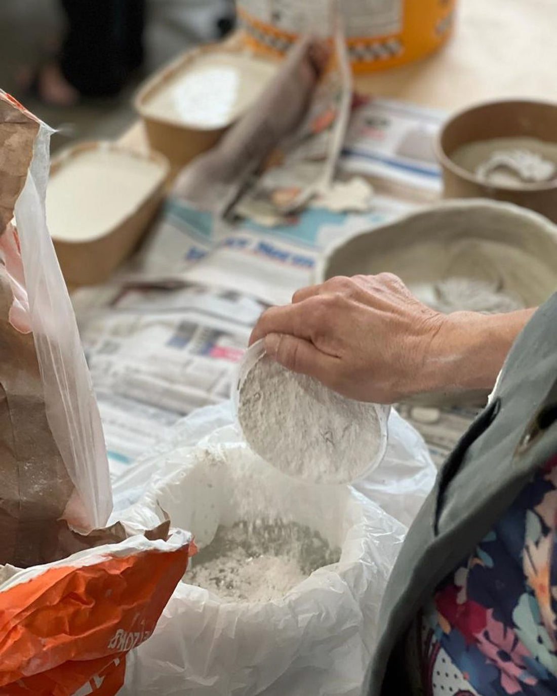 Person working with materials on a table in Jane du Rand masterclass